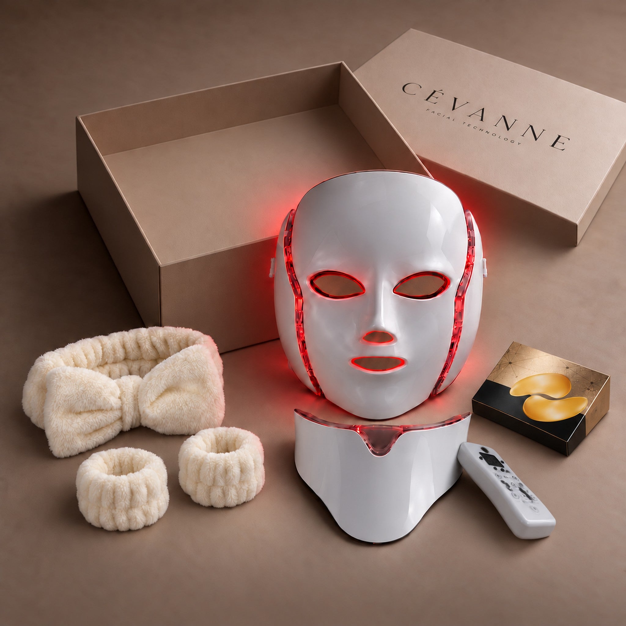 The ATALIA MASK with the box open, showing the neck piece, the remote and the two welcome gifts